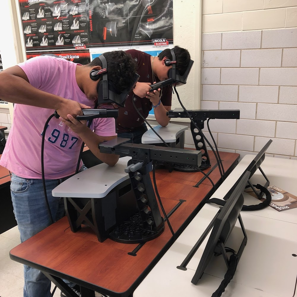Students using welding simulators at Falfurrias High School's Ignite Technical Institute